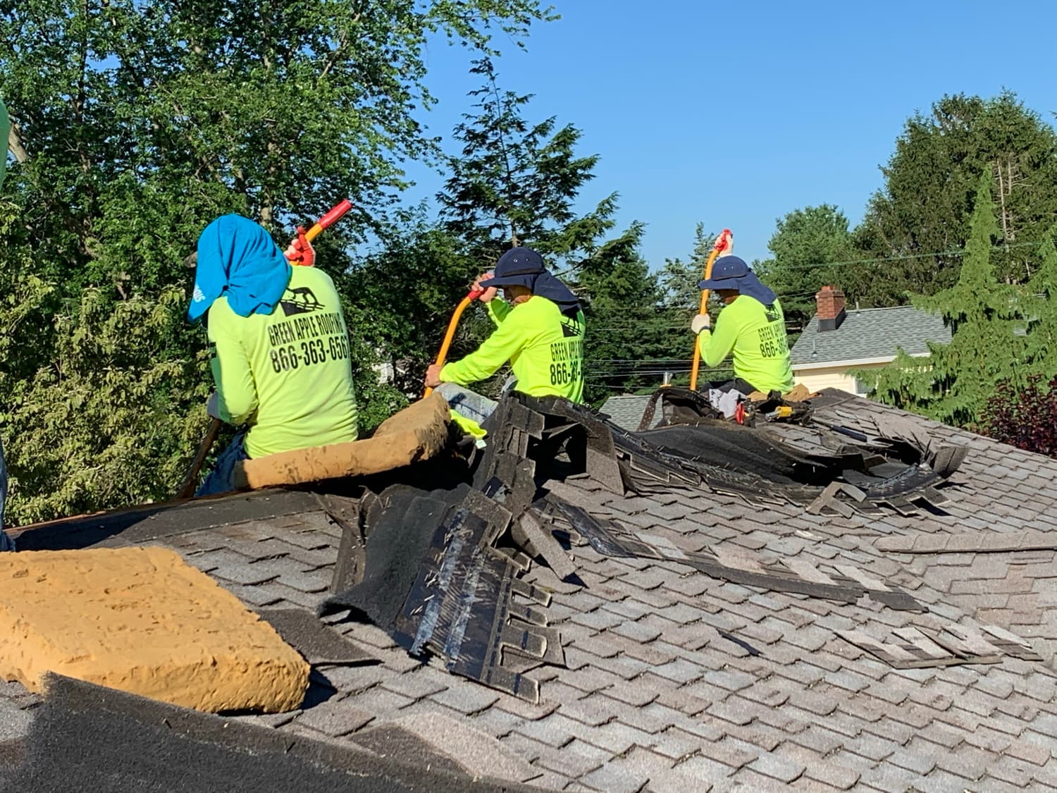 A Green Apple Roofing crew at work on a New Jersey roof